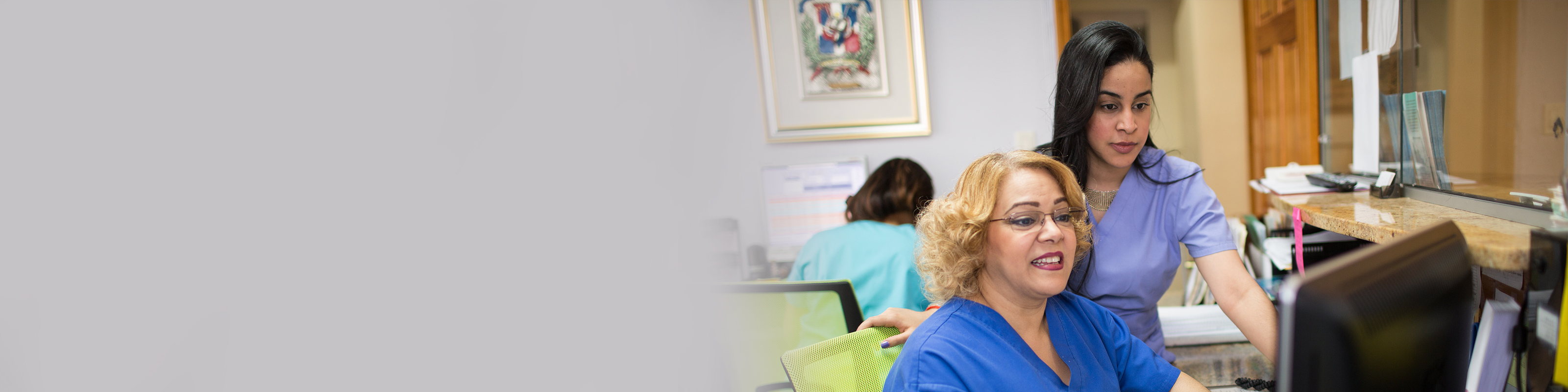 front desk staff looking at computer